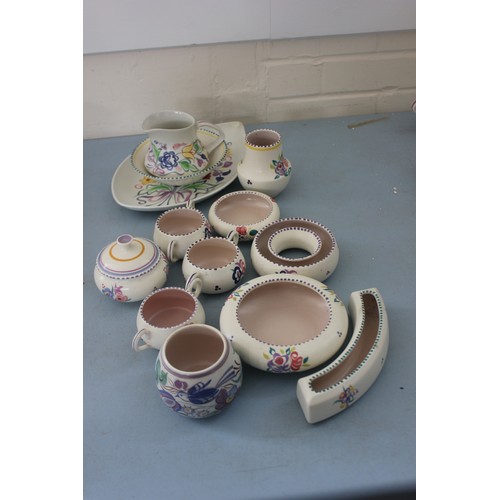 257 - A Poole pottery floral pattern leaf shaped dish, 30cm wide a milk jug, a bowl, two succulent holders... 