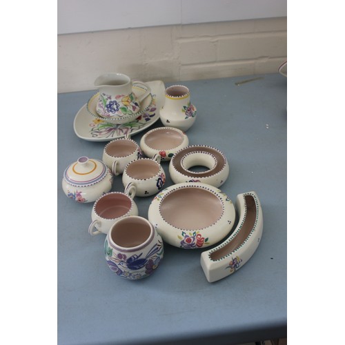 257 - A Poole pottery floral pattern leaf shaped dish, 30cm wide a milk jug, a bowl, two succulent holders... 