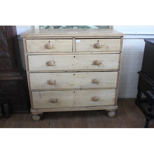 112 - A Victorian stripped pine chest of two short and three long drawers, with knob handles on bun feet, ... 