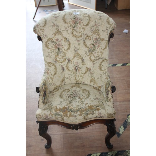 113 - A small Victorian walnut show wood and button upholstered nursing chair, in need of restoration.