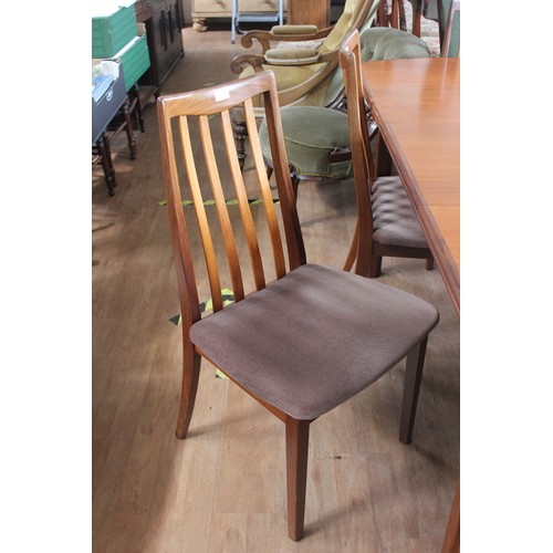 190 - A G-Plan teak Fresco Afromasic design dining table, with hinged folding centre leaf, on chamfered st... 