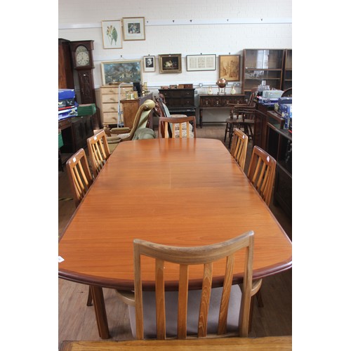 190 - A G-Plan teak Fresco Afromasic design dining table, with hinged folding centre leaf, on chamfered st... 