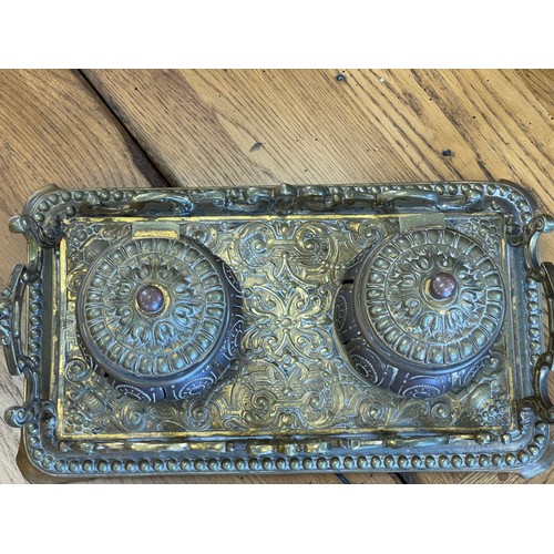 272 - An early 20th century brass ottoman style inkwell, with decorative handles, 27cm wide, with two glas... 