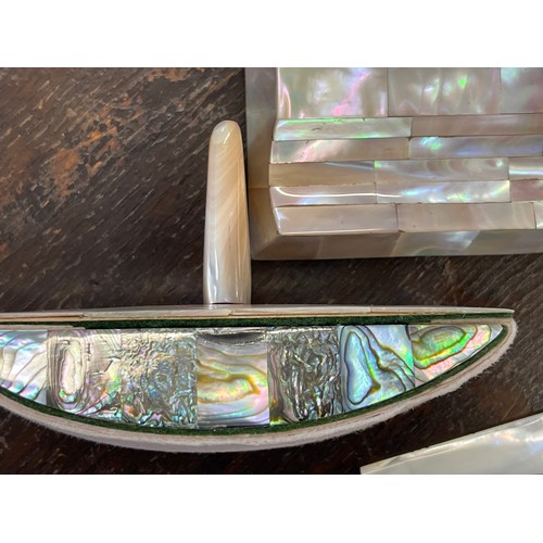 273 - An Art Deco style mother of pearl ink stand, with two glass inkwells, 18cm wide together with an una... 