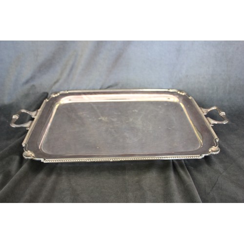 14 - A silver-plated two-handled tray, with gadrooned and shell decoration, 70cm wide.