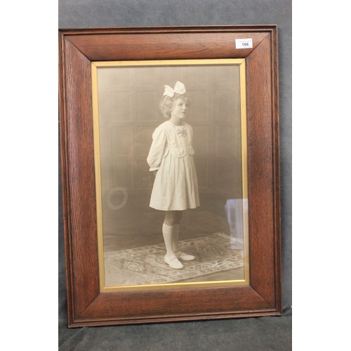 170 - An early 20th century black and white photograph of little girl, in oak frame, 67cm x 49cm, together... 