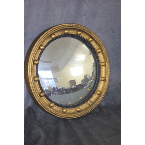 172 - A Regency style circular convex wall mirror, in gilt ball surmounted frame, 40cm in diameter.