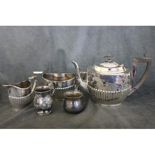 268 - A silver-plated three-piece Queen Anne style tea set, and two small mugs (5).