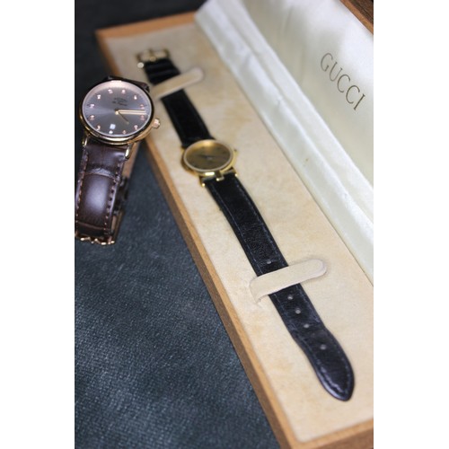 294 - A lady's Rotary quartz wristwatch, in gold-plated case, No. 14567, and a Gucci quartz wristwatch, No... 