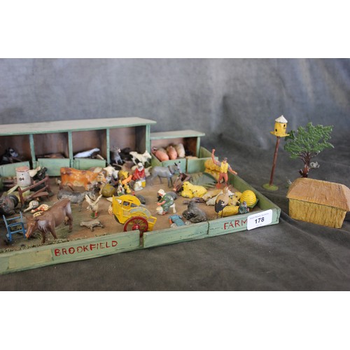 318 - A toy farmyard set with lead figures and accessories by Brittains and other manufacturers.