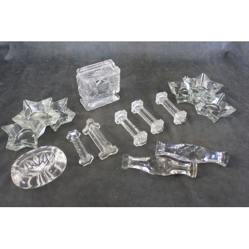 320 - Six glass star shaped tea light holders, seven glass knife rests, an oval salt, and a glass card hol... 