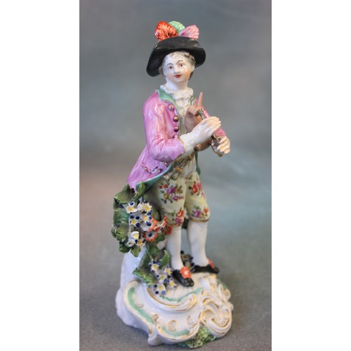 56 - A Derby porcelain figure of a musician, on scroll base, with set of pipes under left arm, ex David H... 