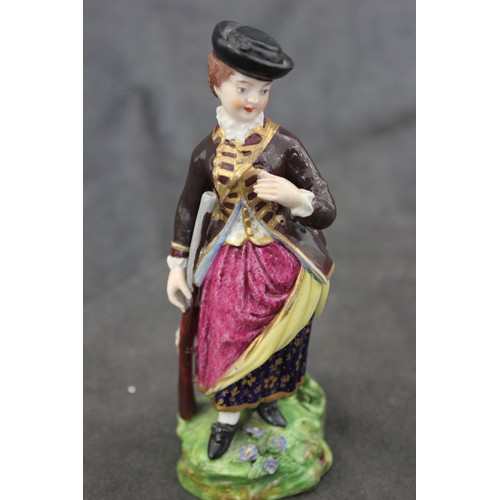 61 - A Bloor Derby figure of sportsman holding a gun, on green flower encrusted base, c. 1810, red mark, ... 