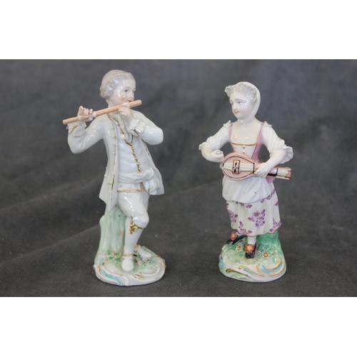 66 - A matched pair of Derby porcelain figures, modelled as musicians, the boy playing a flute, the girl ... 