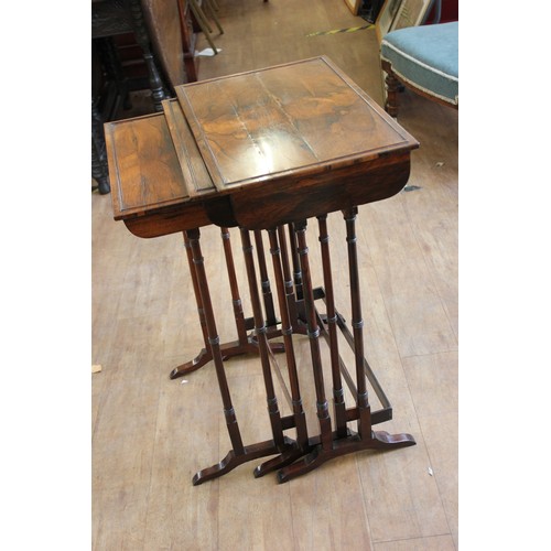 83 - A Regency rosewood nest of three occasional tables, c. 1820, on slender turned and ringed legs, and ... 