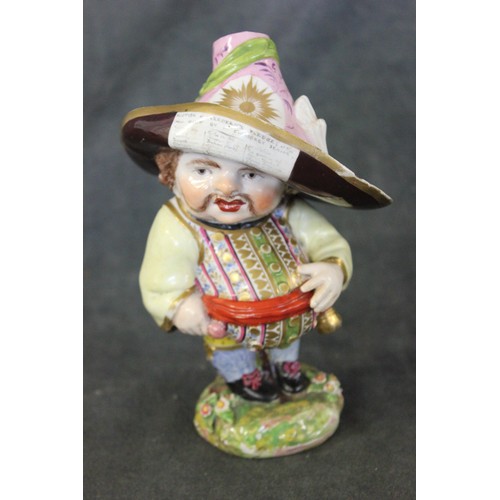 105 - A Derby figure of mansion house dwarf, c. 1785, on floral green base, 17cm high, slightly a.f.