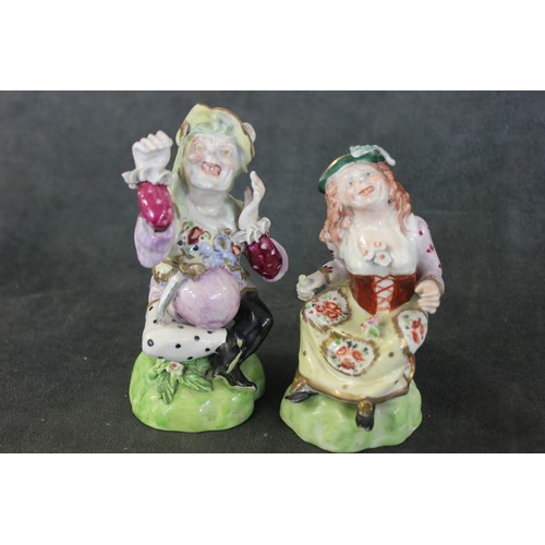 110 - A pair of Derby porcelain figures of grimacing dwarfs, c. 1815, marked in red to bases, and incised ... 