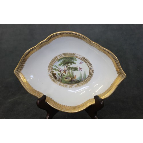 112 - A Derby oval shaped dish painted by George Complin, c. 1796, birds in and around a nest, gilt border... 