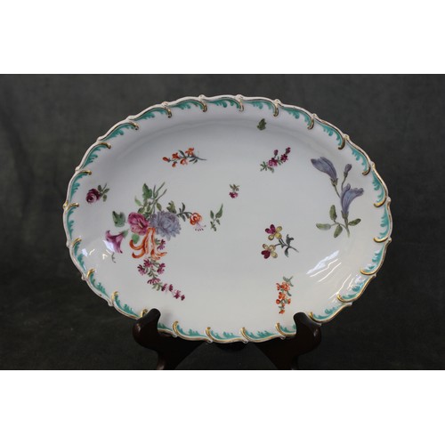 116 - A Chelsea Gold Anchor dish, c. 1765, painted flowers, under a gilt scroll border, 24cm wide, ex Jupi... 