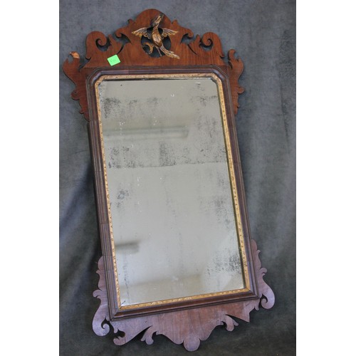 122 - A George III wall mirror in fret frame, with Ho-ho bird crest, 43cm wide x 78cm high, ex The Antique... 