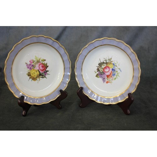 148 - A pair of Derby dessert plates, c. 1790, with floral centres, purple and gilt borders, each 19cm in ... 