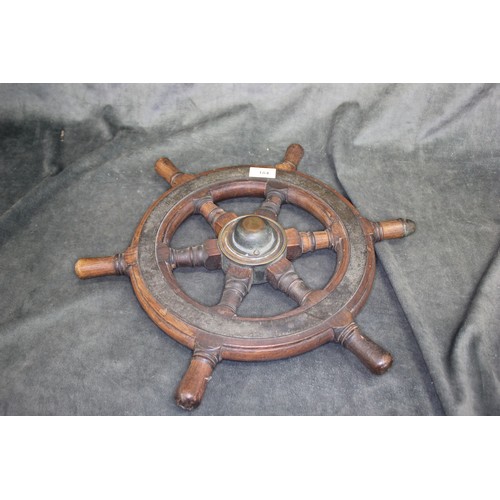 184 - A small stained wood ships wheel, with brass fittings, 46cm in diameter.