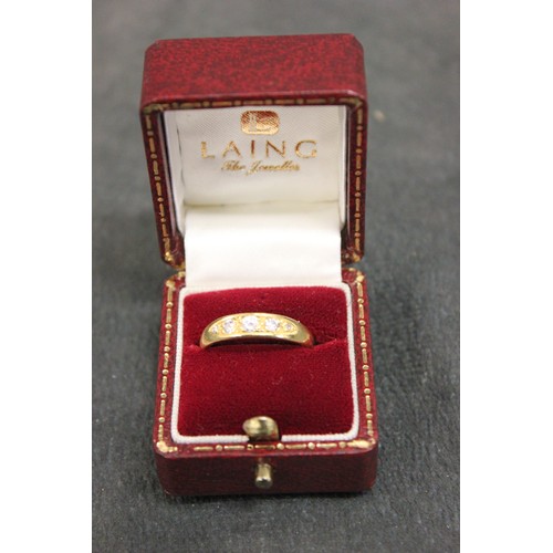 191 - An 18ct gold dress ring, set five graduated diamonds.