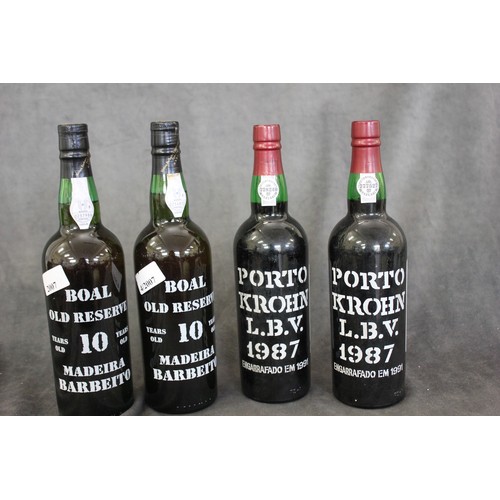 284 - Two bottles of Krohn 1987 late bottled vintage port, ullage low neck, and two bottles Boal 10 year o... 