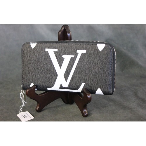 336 - A Louis Vuitton style clutch purse.