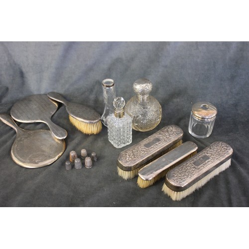 346 - A silver backed three piece dressing table set, Birmingham 1908, a further silver backed hand mirror... 