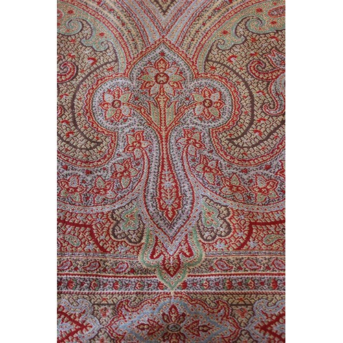 188 - A Kashmiri shawl, of fine texture, with foliate scroll and paisley style pattern, approx. 151cm x 28... 