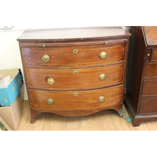 238 - A regency inlaid mahogany bow fronted chest of three long drawers, below a brushing slide, on splay ... 