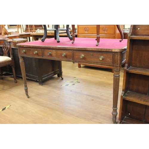 236 - A Regency mahogany partner's writing table, fitted six drawers, on turned and reeded legs, 137cm wid... 