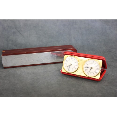 191 - A silver and mahogany pencil box by Garrard and Co Ltd, London 1997, and a red leather travel clock ... 