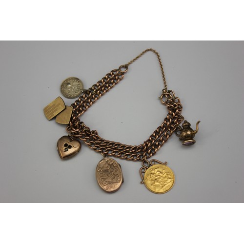 62 - A curb link bracelet, with five charms, together with an Edward VII 1907 half sovereign, unmarked.