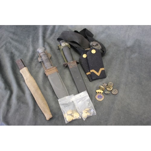 167 - A U.S. military issue knife in scabbard, two further knives, two civilian pilot's cap headbands, two... 