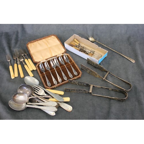 166 - A set of six silver-plated pastry forks, in lined case, two pairs of silver-plated asparagus tongs, ... 