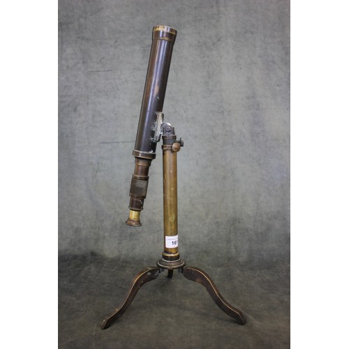 161 - A 19th century brass table-top telescope, on adjustable column legs and tripod base, stamped 