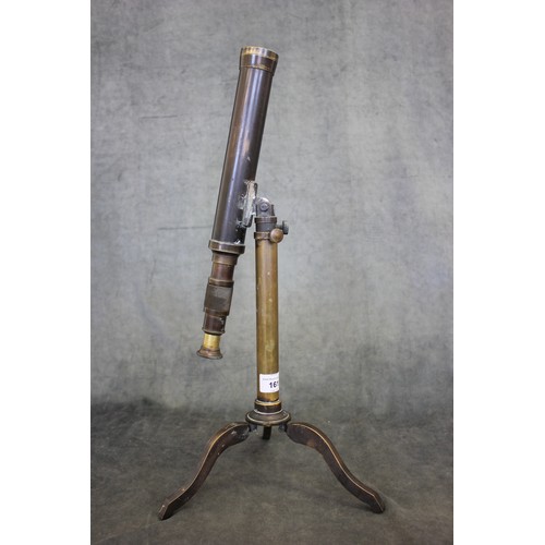 161 - A 19th century brass table-top telescope, on adjustable column legs and tripod base, stamped 