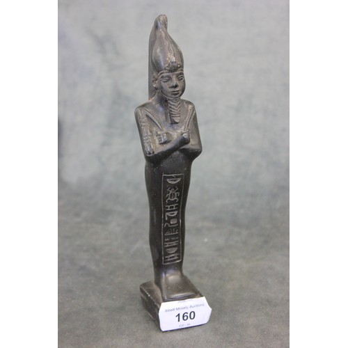 160 - A carved resin Egyptian tomb type figure, 21cm high.