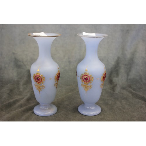 137 - A pair of early 20th century French turquoise glass vases, with gilt decoration and studded with syn... 