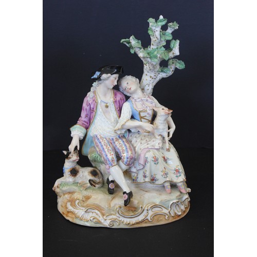 58 - A 19th century Meissen Porcelain group of a youth & shepherdess on part scrolled base. 28cm high