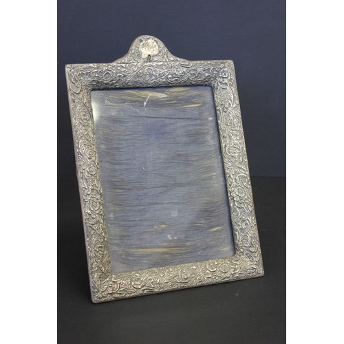 182 - A late Victorian silver photograph frame, with foliate scroll decoration, Birmingham 1900, 27cm x 19... 