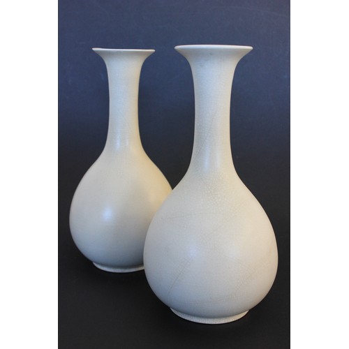 21 - A pair of Japanese 20th century pottery sake vases, in the style of Ikebana Kabin Ikura, with slende... 