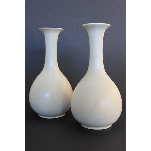 21 - A pair of Japanese 20th century pottery sake vases, in the style of Ikebana Kabin Ikura, with slende... 