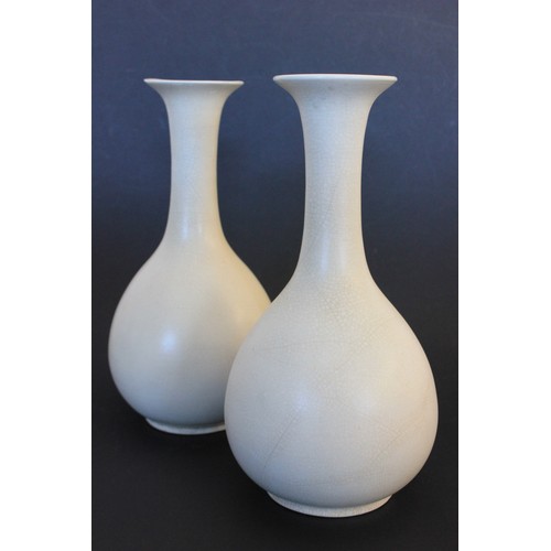 21 - A pair of Japanese 20th century pottery sake vases, in the style of Ikebana Kabin Ikura, with slende... 