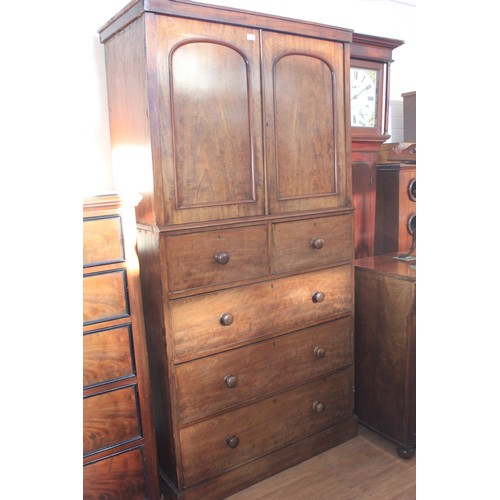 29 - A Victorian mahogany cabinet on chest, adapted from the centre section of a wardrobe, fitted two sho... 