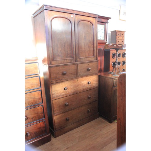 29 - A Victorian mahogany cabinet on chest, adapted from the centre section of a wardrobe, fitted two sho... 