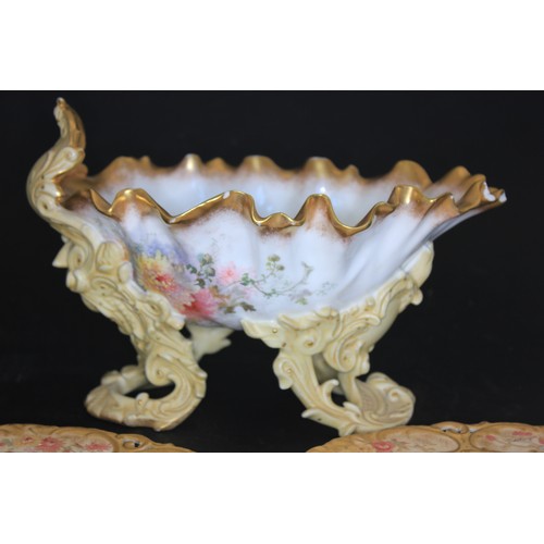 80 - A Doulton Burslem shell-shaped jardiniere, on rocaille pierced bracket feet, decorated flowers, deco... 