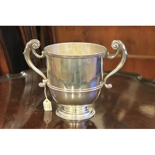 157 - A George V silver two handled cup, on circular foot, London 1911, approx 19oz.